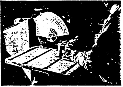 ILLUSTRATION No. 38 The direction of rotation of the cutting-off wheel is indicated by the arrow on the guard. This is also the direction the nut must be turned for removal.